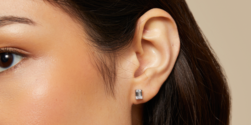 Women wearing diamond stud earrings